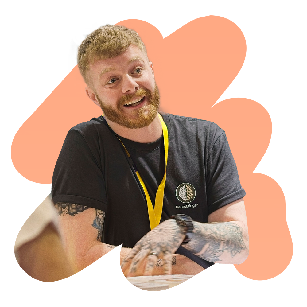 Chris from the NeuroBridge Neurodiversity Support Team inside an abstract shape