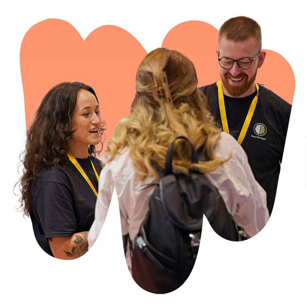 Josh and Kali from the NeuroBridge Neurodiversity Support Team inside an abstract shape